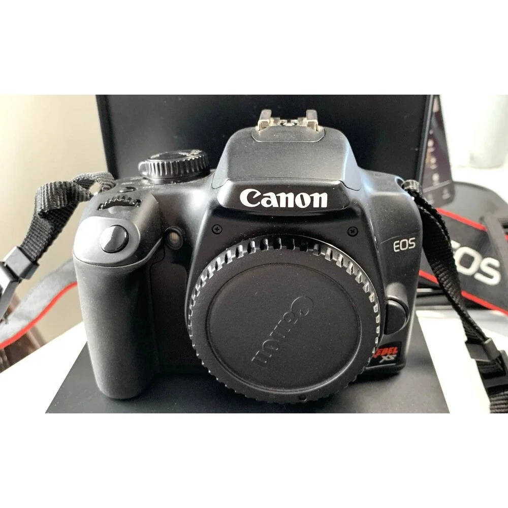 Canon EOS Rebel XS 10.1MP DSLR Camera w/8-55mm Lens Charger Bag Battery &LensPen